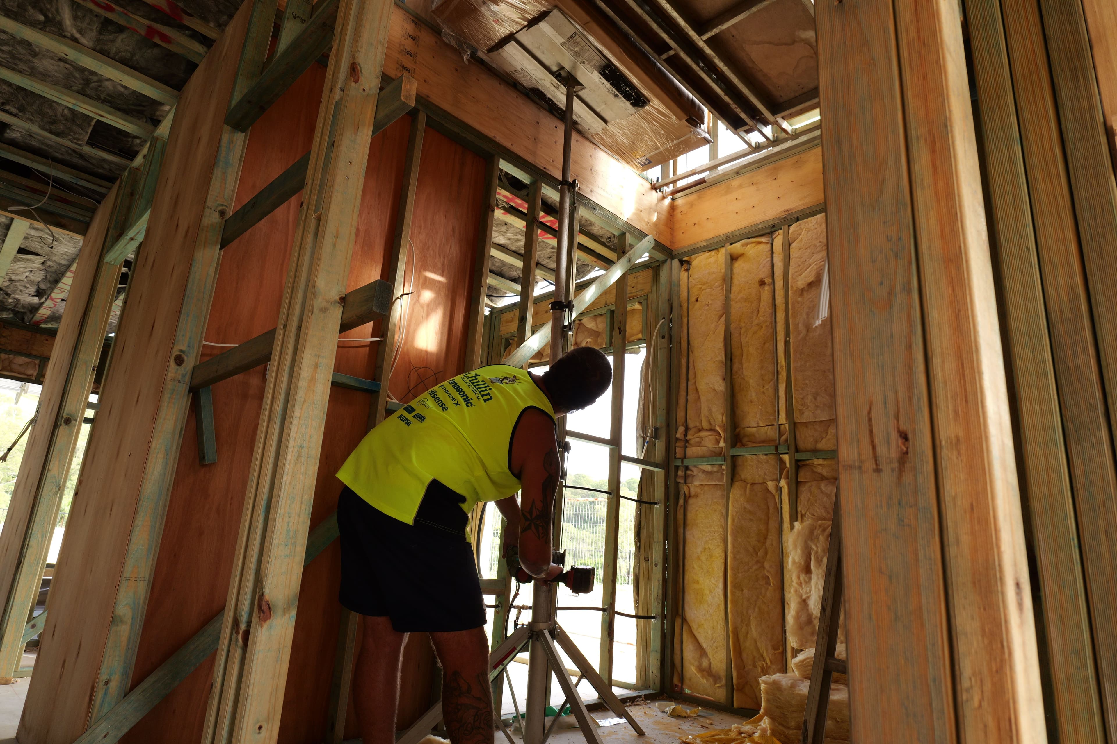 Chillin technician working inside a framed Queensland home